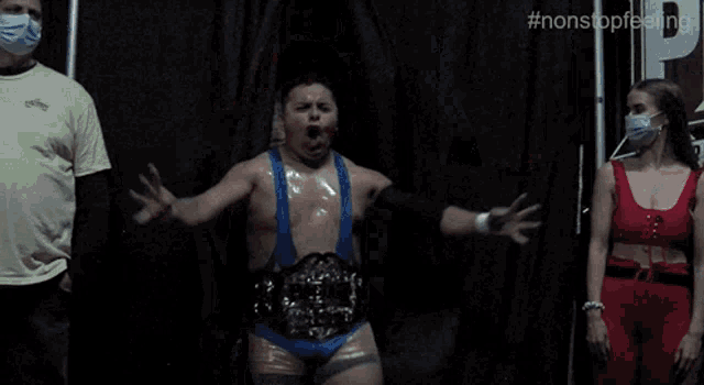 a wrestler with a belt that says world heavyweight championship on it