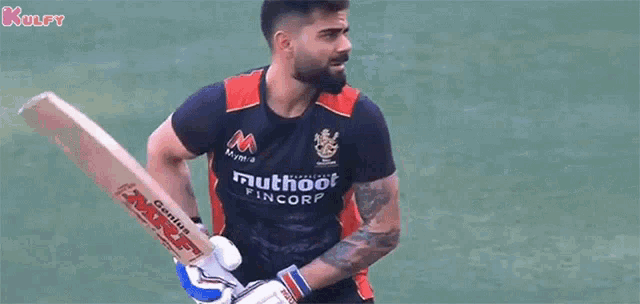 a man is playing a game of cricket and holding a bat in his hand .