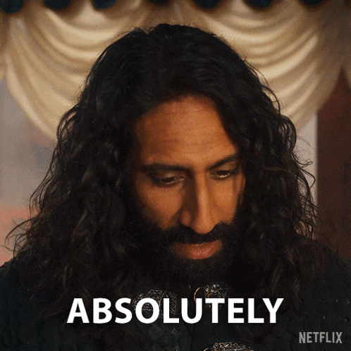 a man with long hair and a beard has the word absolutely above him