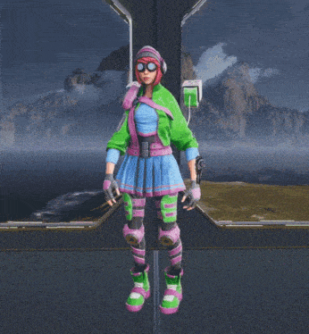 a woman in a green and pink outfit is standing on a pole