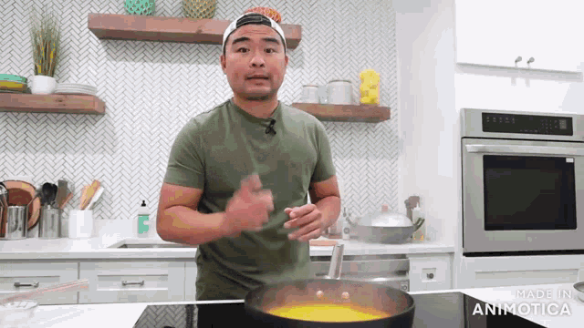 a man is cooking in a kitchen with the words made in animatica on the bottom right