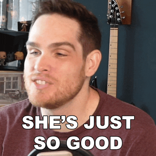 a man says she 's just so good with a guitar in the background