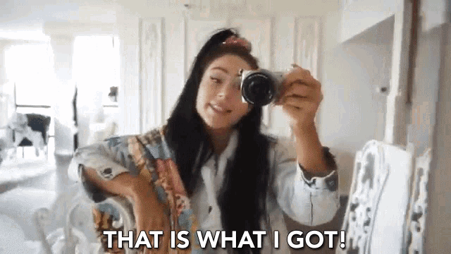 a woman taking a picture of herself with the words that is what i got below her