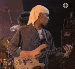 a man is playing a guitar in front of an amplifier that says lust