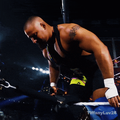 a man in a wrestling ring with tiffanylu24 on the bottom right