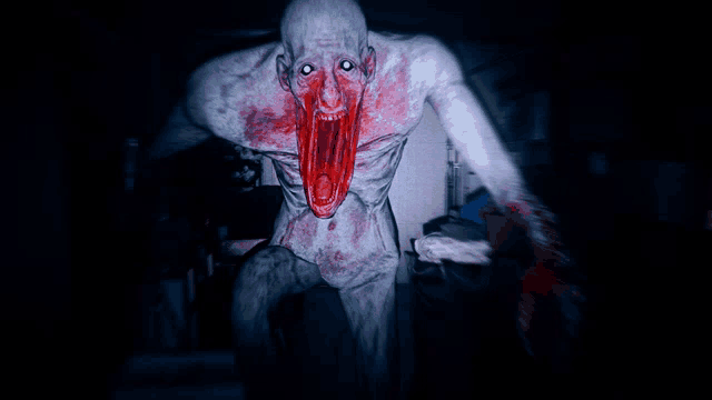 a bloody monster with its mouth wide open and blood coming out of it
