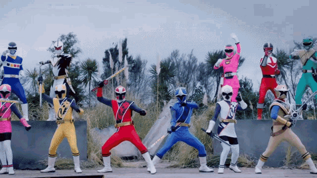 a group of power rangers are lined up in a line