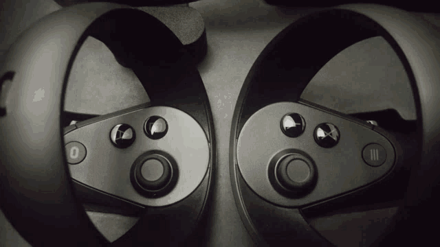 a pair of oculus rift controllers with the numbers 0 and 3