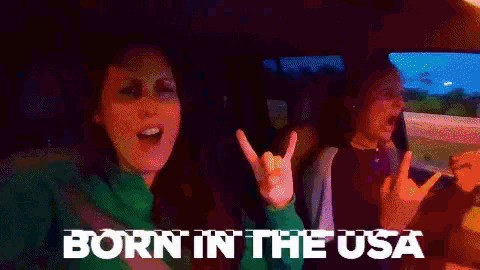 two women in a car with the words born in the usa on the bottom