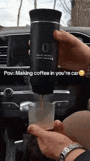 a person is pouring coffee into a cup in a car with the caption pov making coffee in you 're car