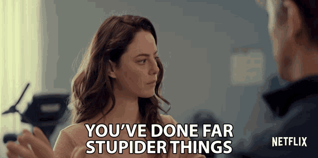 a woman talking to a man with the words " you 've done far stupider things "