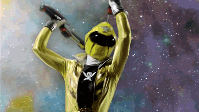 a yellow power ranger with a skull and crossbones logo on his chest