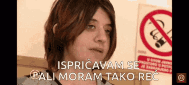 a woman in front of a no smoking sign says pali moram tako rec