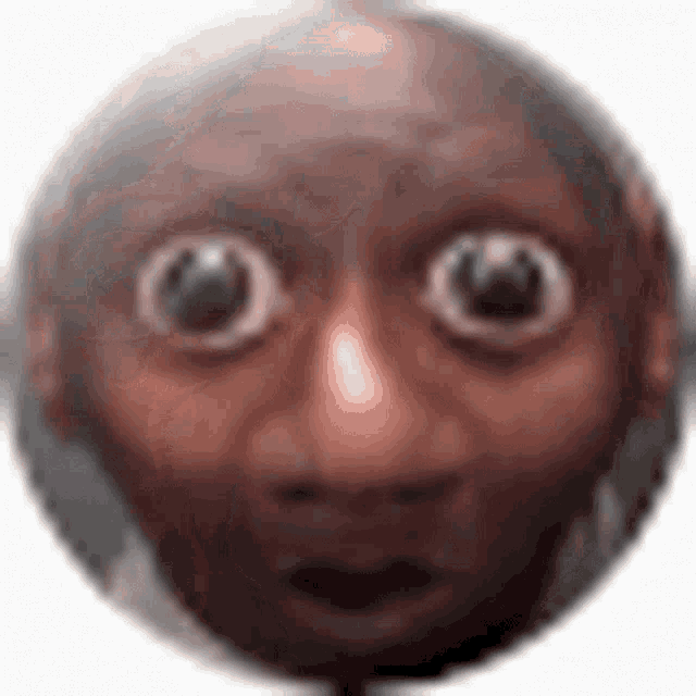 a close up of a cartoon character 's face with big eyes .