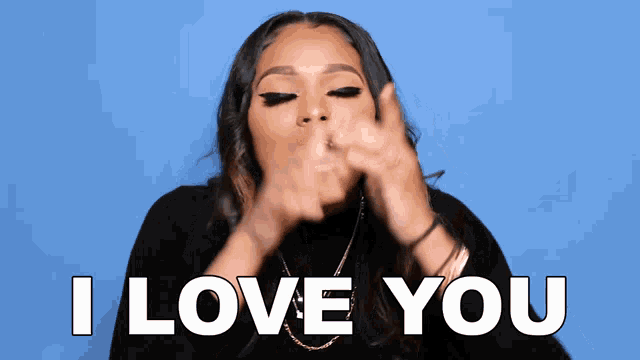 a woman blowing a kiss with the words " i love you " behind her