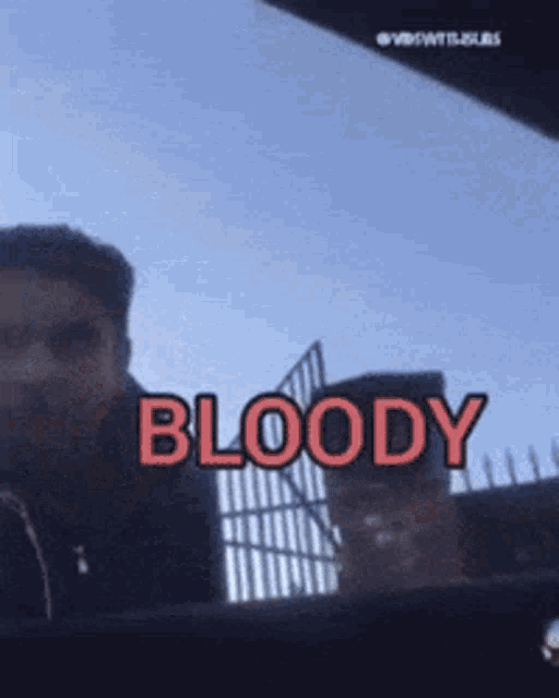 a man in a car with the word bloody in red