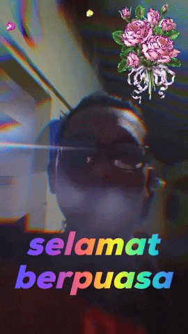 a man wearing sunglasses and a mask with the words selamat berpuasa