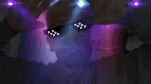 a person wearing a pair of pixelated sunglasses with a checkered pattern on them