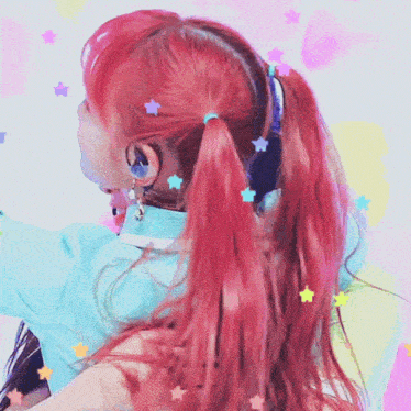 a close up of a woman 's red hair with stars in it