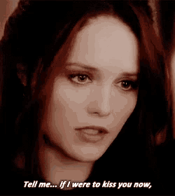 a woman with red hair is saying tell me if i were to kiss you now .