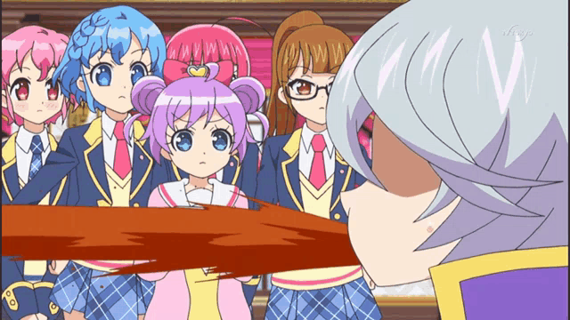 a group of anime girls are standing next to each other with the letter v visible