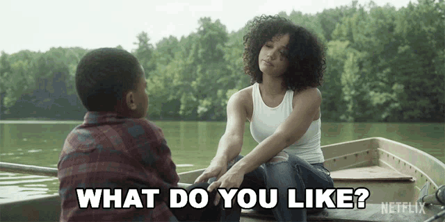 a man and a woman are sitting in a boat and the woman is saying what do you like