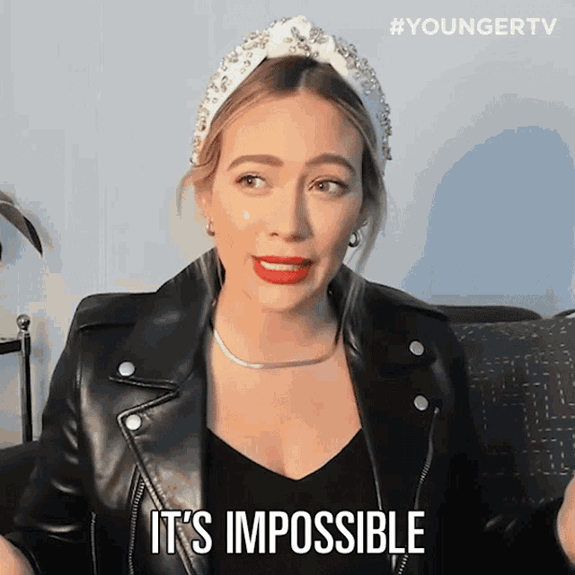 a woman wearing a headband and a leather jacket says it 's impossible