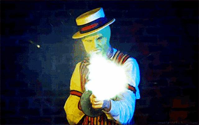 a man with a green mask is holding a gun in his hand