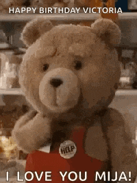 a teddy bear is wearing a red apron and says `` happy birthday victoria i love you mija ! ''
