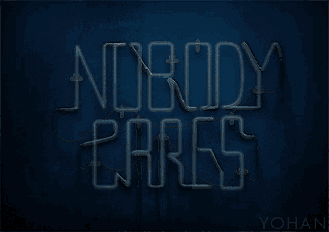 neon sign that says nobody cares on a dark blue background