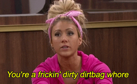 a woman in a pink shirt is saying " you 're a fricking dirty dirtbag whore "