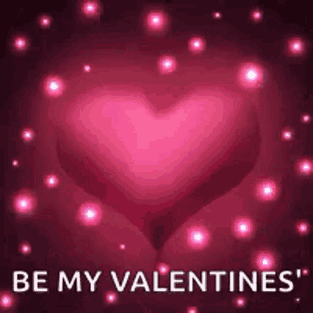 a pink heart with the words `` be my valentines '' written on it surrounded by pink lights .
