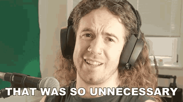 a man is wearing headphones and says that was so unnecessary