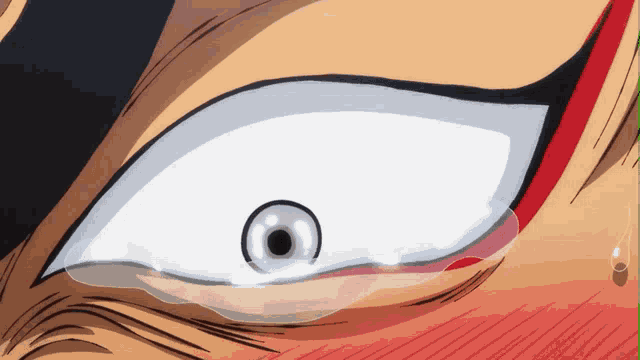 a close up of a person 's eye with a tear running down it
