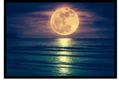 a full moon shines over the ocean with waves