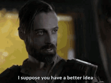 a man with a beard is saying `` i suppose you have a better idea '' while holding a book .