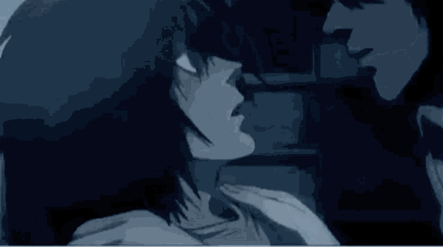 a couple of anime characters are kissing in the dark .