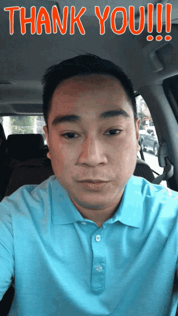 a man in a blue shirt is taking a selfie with the words thank you !!! above his face