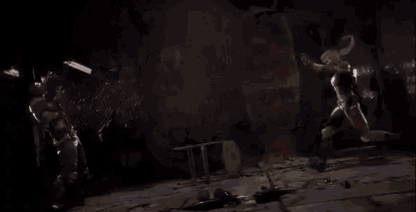 a man and a woman are fighting each other in a video game .