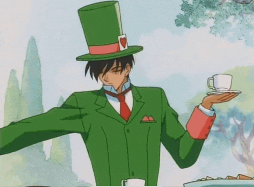 a man in a green suit and top hat holds a cup