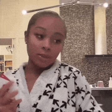 a woman in a bathrobe with arrows on it