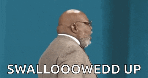 a man in a suit and tie is saying swallowoowed up