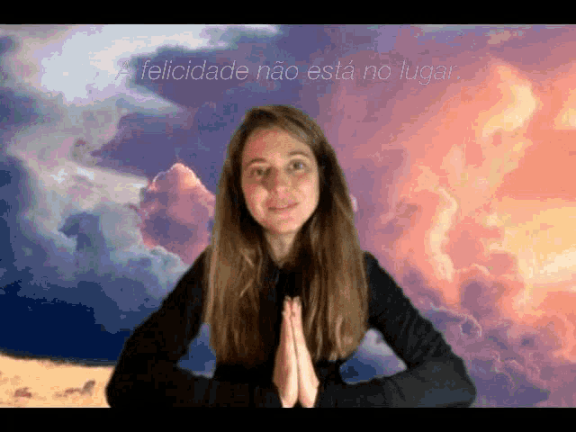 a woman stands in front of a cloudy sky with the words a felicidade nao esta no lugar