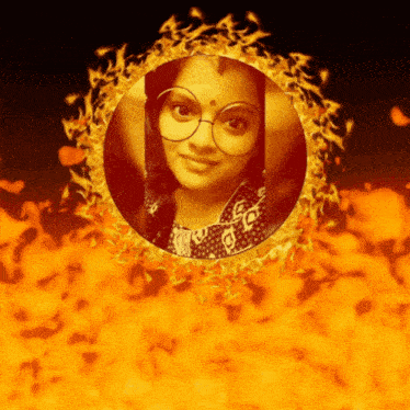 a woman with glasses is in a circle of flames