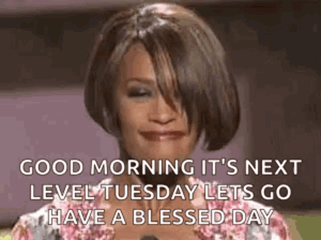 a woman is smiling and saying `` good morning it 's next level tuesday lets go have a blessed day ''