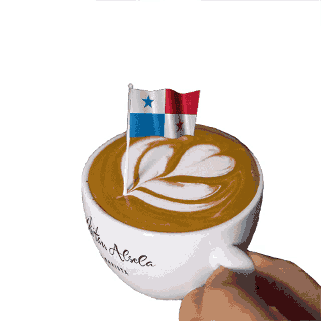 a person is holding a cup of coffee with a flag on top of it