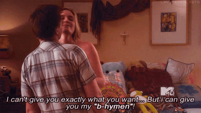 a man and woman in a bedroom with a mtv logo on the bottom right