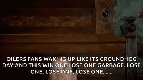 a man is waking up in a bed with the words oilers fans waking up like its groundhog day and this win one lose one garbage