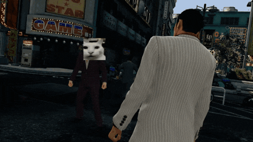 a man in a suit is standing in front of a building that says game