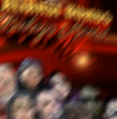 a blurry picture of a group of people standing in front of a red wall